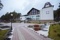 Beautiful curb appeal of a classic holiday home in Siberia with a beautiful front yard landscaping. Image of landscaping.