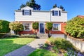 Beautiful curb appeal of two level house with brick and white siding. Royalty Free Stock Photo