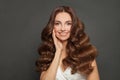 Beautiful Curly Hair. Smiling Woman With Healthy Wavy Long Brown Hair. Portrait of Happy Woman With Beauty Face Royalty Free Stock Photo