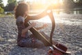 Beautiful curly hair woman playing the harp Royalty Free Stock Photo