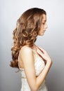 Beautiful Curly Hair. Young Woman With Healthy Wavy Long Blonde Hair. Royalty Free Stock Photo