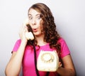 Beautiful curly woman talking on white vintage telephone Royalty Free Stock Photo