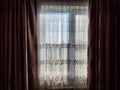 Beautiful curtains on the window with tulle, thick curtains and the sky in the background. Abstract texture, frame Royalty Free Stock Photo