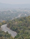 Beautiful curvey road through National Park forest in india