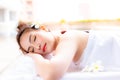 Beautiful customer woman is using hot stone for massaging her ba Royalty Free Stock Photo