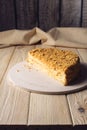 Beautiful cut in half layered Napoleon cake on wooden table