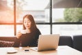 Beautiful cute asia girl in the cafe near the window with coffee smiling and work space, relax. Royalty Free Stock Photo