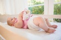 Beautiful cute baby girl in her crib Royalty Free Stock Photo