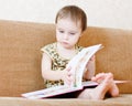 Beautiful cute baby reading a book Royalty Free Stock Photo