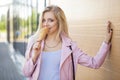 Beautiful cute funny amazing young hipster teen girl eating ice cream cone, laughs happy, bright casual wear, orange Royalty Free Stock Photo