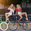 Beautiful cute girls with bicycles- outdoor summer portrait Royalty Free Stock Photo