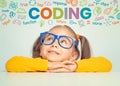 Beautiful cute little girl with eyeglasses looking at colorful CODING word, symbols and commands above her head. Kid programmer l