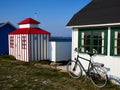 Beautiful cute little wooden beach huts summer houses, painted in lively colors, Aero Island, South Funen, Denmark