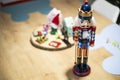 Beautiful and cute modern wooden soldier as a Christmas decoration on a wooden table