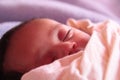 Indian asian small baby smile in sleep Royalty Free Stock Photo