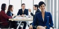 Beautiful cute short hair businesswoman sitting with her team blur in background Royalty Free Stock Photo