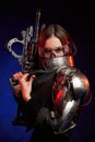 Fashionable female mercenary with furutistic rifle in dark background