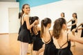 Beautiful dance instructor teaching ballet