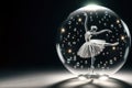 Beautiful dancing ballerina inside a glass ball. Space for text. Royalty Free Stock Photo