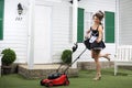 Beautiful dancing housemaid and lawn mower
