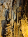 Beautiful dark cave interior with ancient stalactites and stalagmites Royalty Free Stock Photo