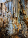 Beautiful dark cave interior with ancient stalactites and stalagmites. Wild nature Royalty Free Stock Photo