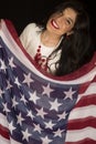 Beautiful dark complected woman holding an American flag