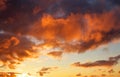 Beautiful dark fluffy cloudy sky with sun rays. Sunset light Royalty Free Stock Photo