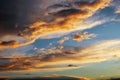 Beautiful dark fluffy cloudy sky. Sunset light Royalty Free Stock Photo