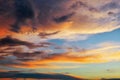 Beautiful dark fluffy cloudy sky. Sunset light Royalty Free Stock Photo