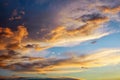 Beautiful dark fluffy cloudy sky. Sunset light Royalty Free Stock Photo