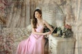 Beautiful dark-haired girl in the pink evening dress Royalty Free Stock Photo