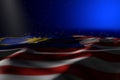 Beautiful dark photo of Malaysia flag lying on blue background with selective focus and empty space for text - any holiday flag 3d