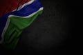 Beautiful dark picture of Gambia flag with large folds on black stone with free space for your content - any feast flag 3d