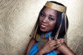 Beautiful dark-skinned girl black woman in the image of the Egyptian queen with red lips bright makeup demonstrates long nails Royalty Free Stock Photo