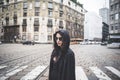 Beautiful dark vampire woman with black mantle and hood Royalty Free Stock Photo