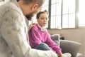 Father calming beautiful teenage daughter feeling stressed