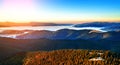 Beautiful dawn in the mountain range. Mountains shrouded in mist in a scenic landscape view. Location Carpathian mountains