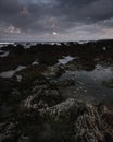 Beautiful dawn scene on rocky beach during low tide in Freshwater West, Pembrokeshire, South Wales,UK Royalty Free Stock Photo