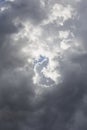 Beautiful day cloudscape view from below of dramatic dramatic grey and white thunder storm clouds on a dark sky background Royalty Free Stock Photo