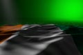 Beautiful dark image of Cote d Ivoire flag lie on green background with bokeh and empty space for content - any feast flag 3d