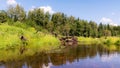 Beautiful day on the river, sandstone cliffs and tree reflections in the water, blue sky reflected in the river water Royalty Free Stock Photo