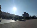 Beautiful daylight city background, empty street with a park