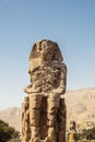 Beautiful daytime view of the Colossi of Memnon. Two large stone figures depicting a seated pharaoh.