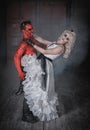 Beautiful dead bride dance with terrible demon. Scary Halloween scene