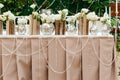 Beautiful decor at the wedding. The flowers on the background of the boards.