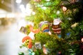 Beautiful decorated Christmas tree on blurred sparkling or bokeh background at night, decorate Xmas tree with Santa Claus doll, Royalty Free Stock Photo