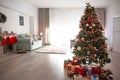 Beautiful decorated Christmas tree in cozy living room Royalty Free Stock Photo