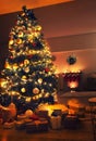 Beautiful decorated Christmas tree with gifts in living room Royalty Free Stock Photo