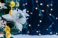 Beautiful decorated christmas tree with snow on the blurred bokeh of the garland. Holiday background Royalty Free Stock Photo